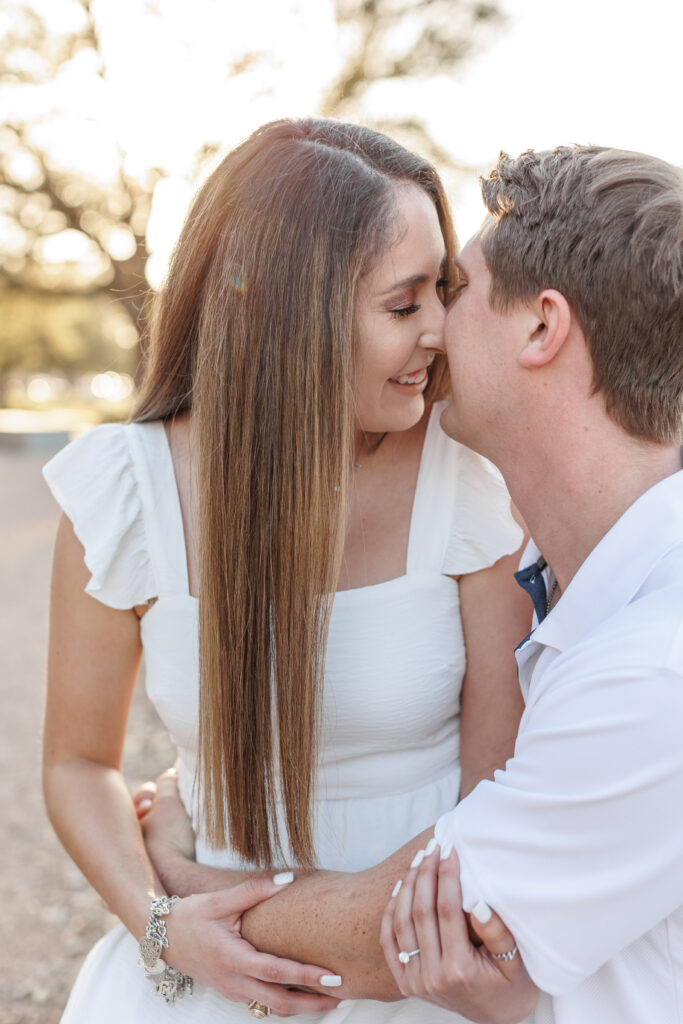 male and female couple pose for engagement photos