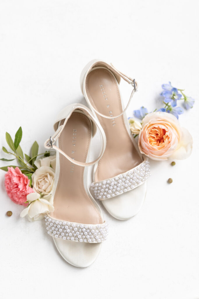 olde dobbin station wedding flat lay photos - bride shoes with florals surrounding them