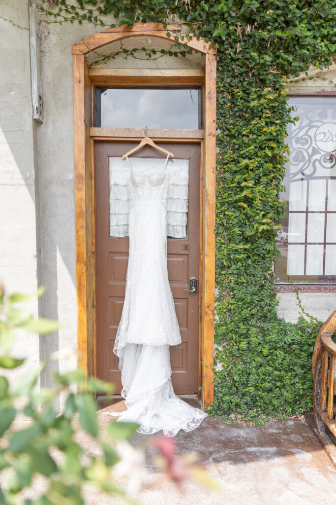 Olde Dobbin Station Wedding - Dress hanging from the bridal suite door