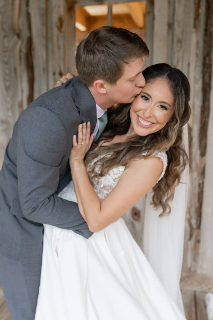 husband and wife kissing and posing for texas old town wedding photos